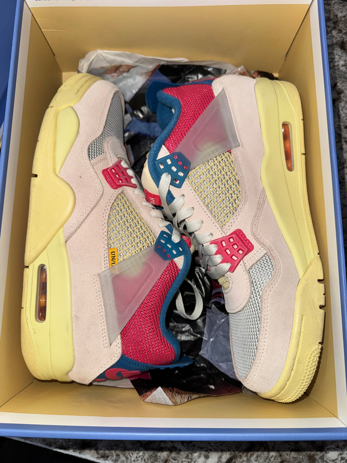 Jordan 4 Retro Union Guava Ice